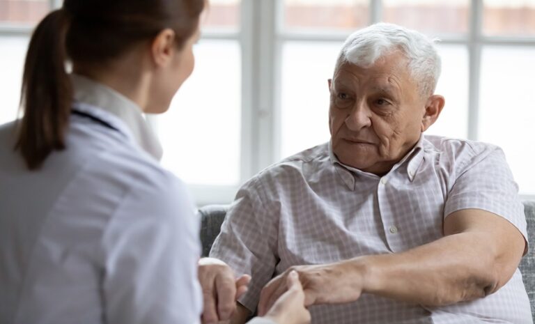 Physician discussing long COVID Medicare spending and health care needs with an older adult