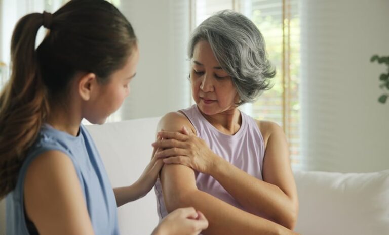 Adult applying ruxolitinib cream for moderate atopic dermatitis and persistent dry, itchy skin.