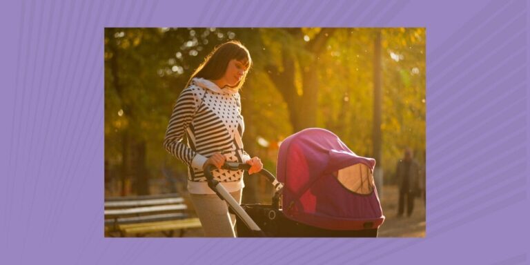 Mom pushing baby in stroller during golden hour sunset