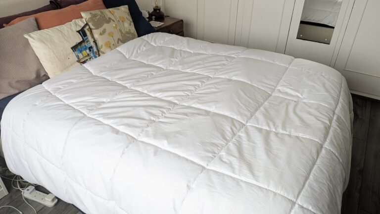 The Tempur Luxe Fibre Cooling Duvet on a mattress in a bedroom