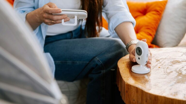 Woman looking at a baby monitor