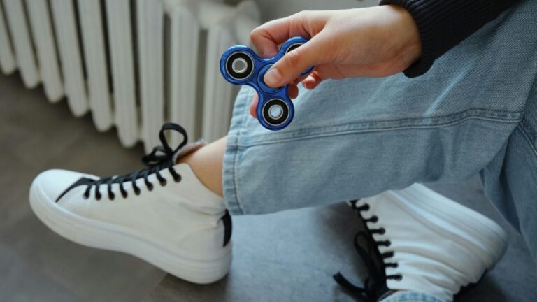 Child holding a fidget spinner