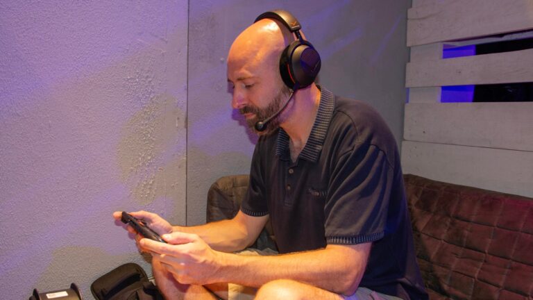 Journalist Andy White wearing the Beyerdynamic MMX 130 open-back gaming headset while playing a Nintendo Switch 2